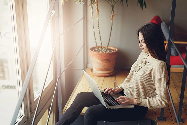 woman working on her laptop