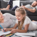 How to Enjoy a Permanently Cockroach-Free Home - woman and young girl laying on floor drawing on paper